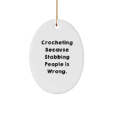 Funny Crocheting Gifts for Friends and Family, Oval Ornament with 'Crocheting Because Stabbing People Is Wrong.' Quote, Christmas Unique Presents - Image 1